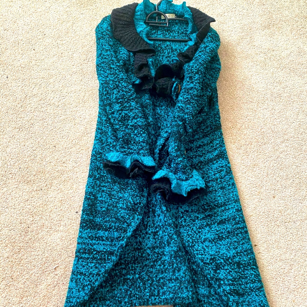 Long blue sweater with ruffles
